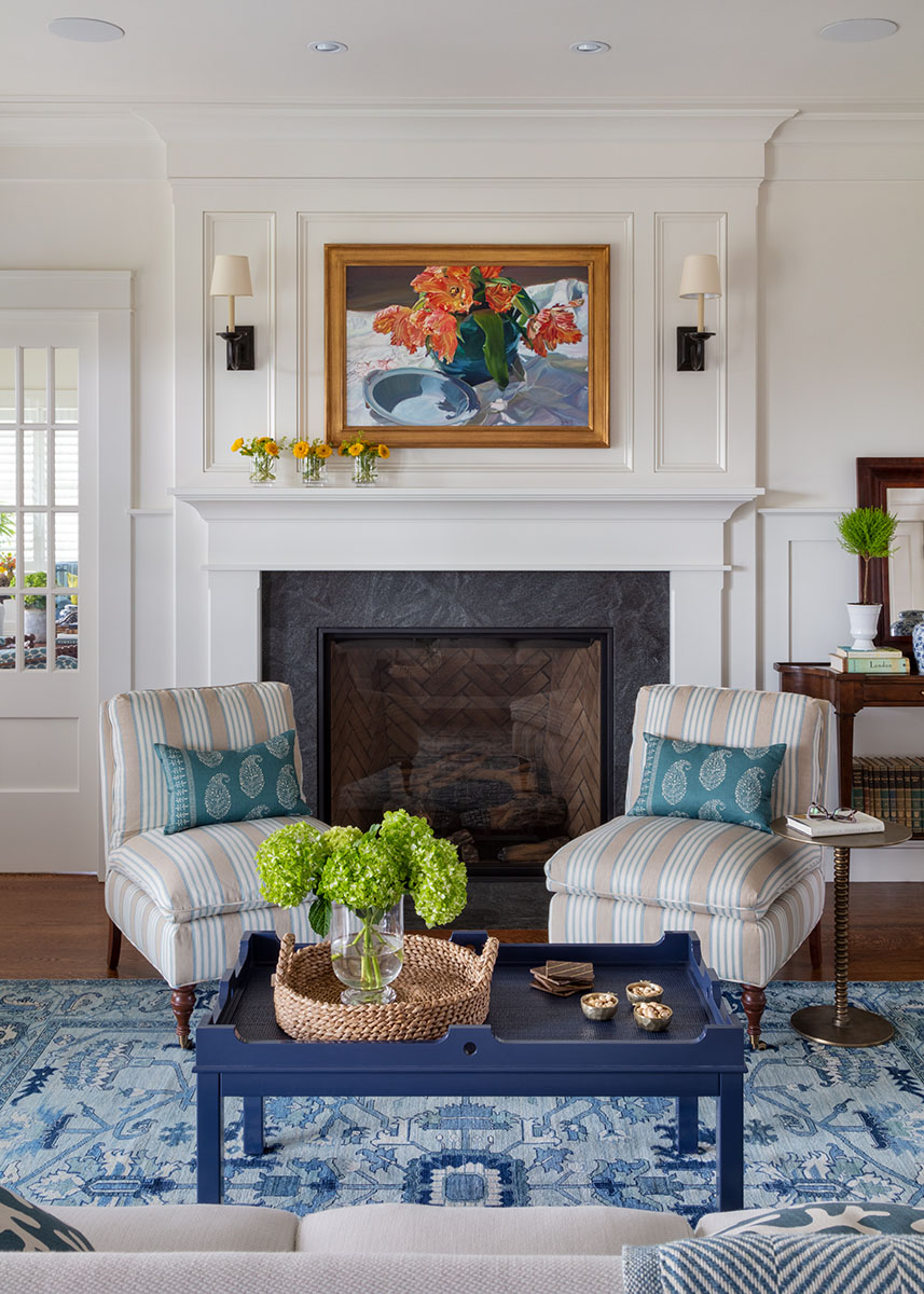 coastally inspired living room with seating area and fireplace