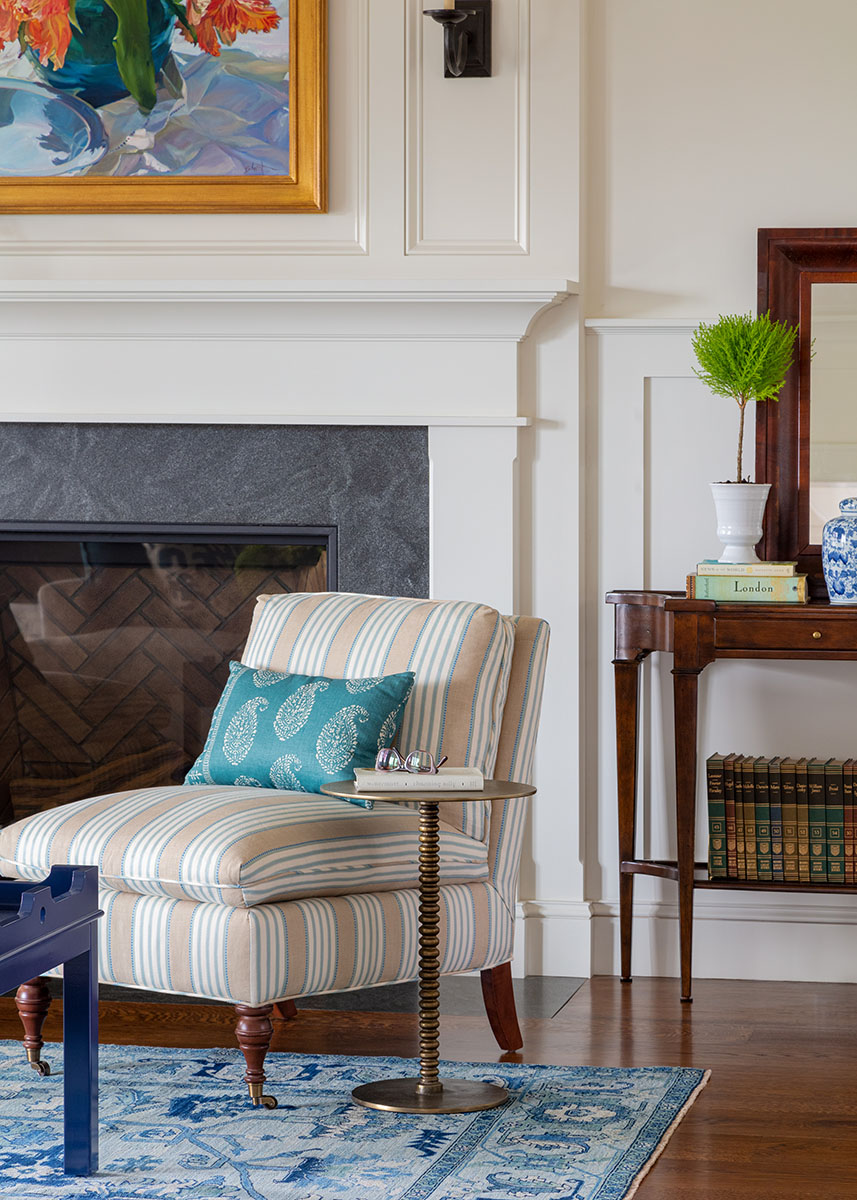 custom chair in living room with fireplace