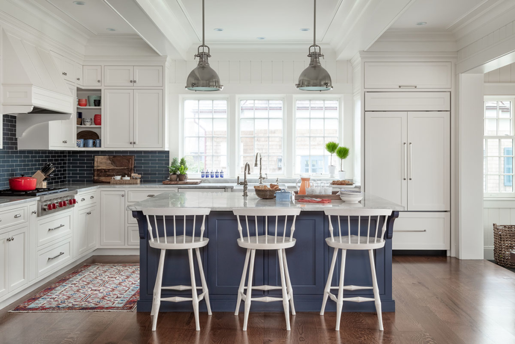 coastal kitchen with pendant lights, large island and counter stools