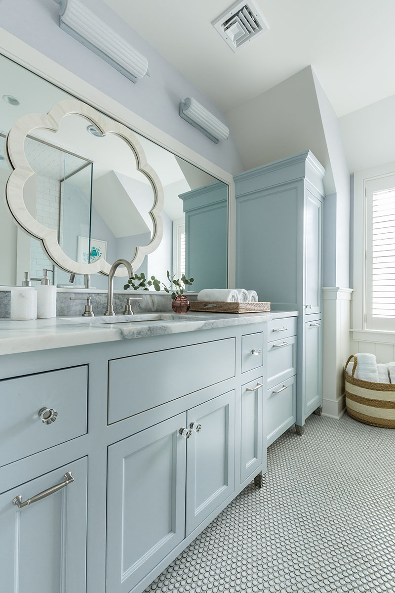 guest bath with large vanity and painted cabinetry