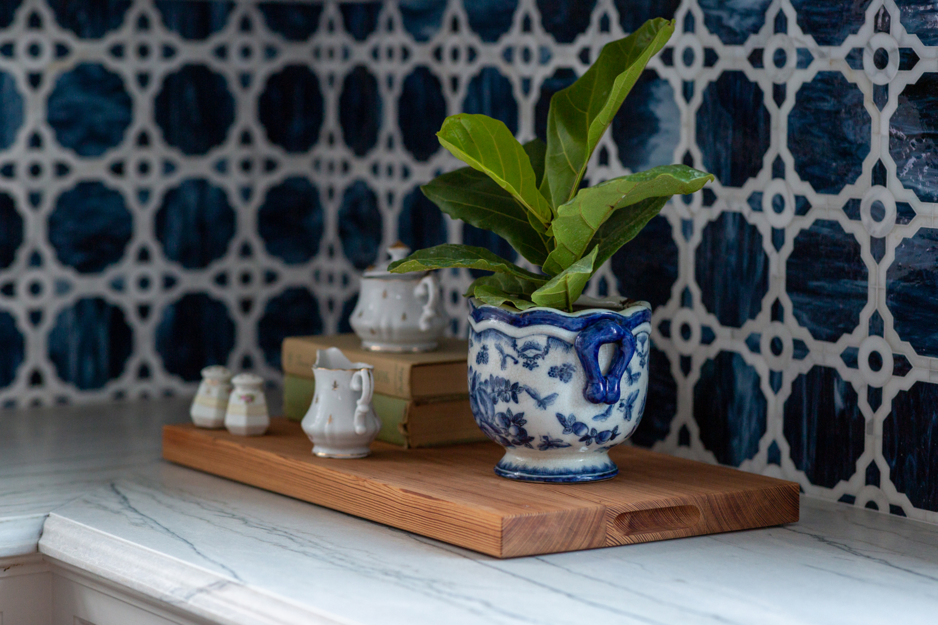 kitchen counter and backsplash with cutting board