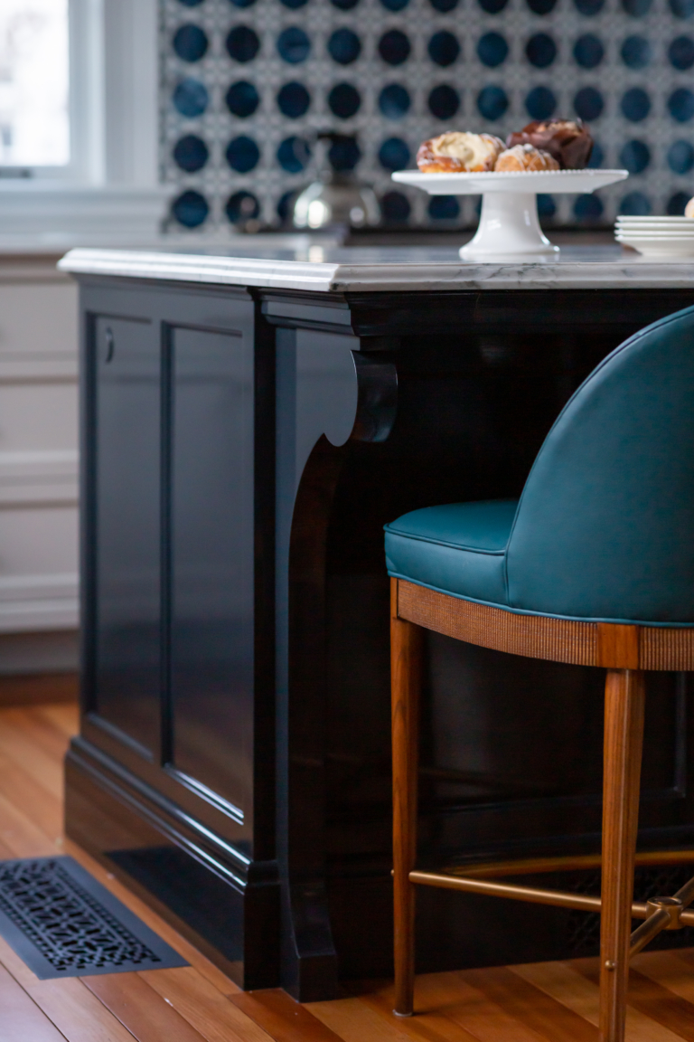 kitchen island with custom millwork and barstools