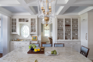large island in kitchen with built-in storage and pendant lighting