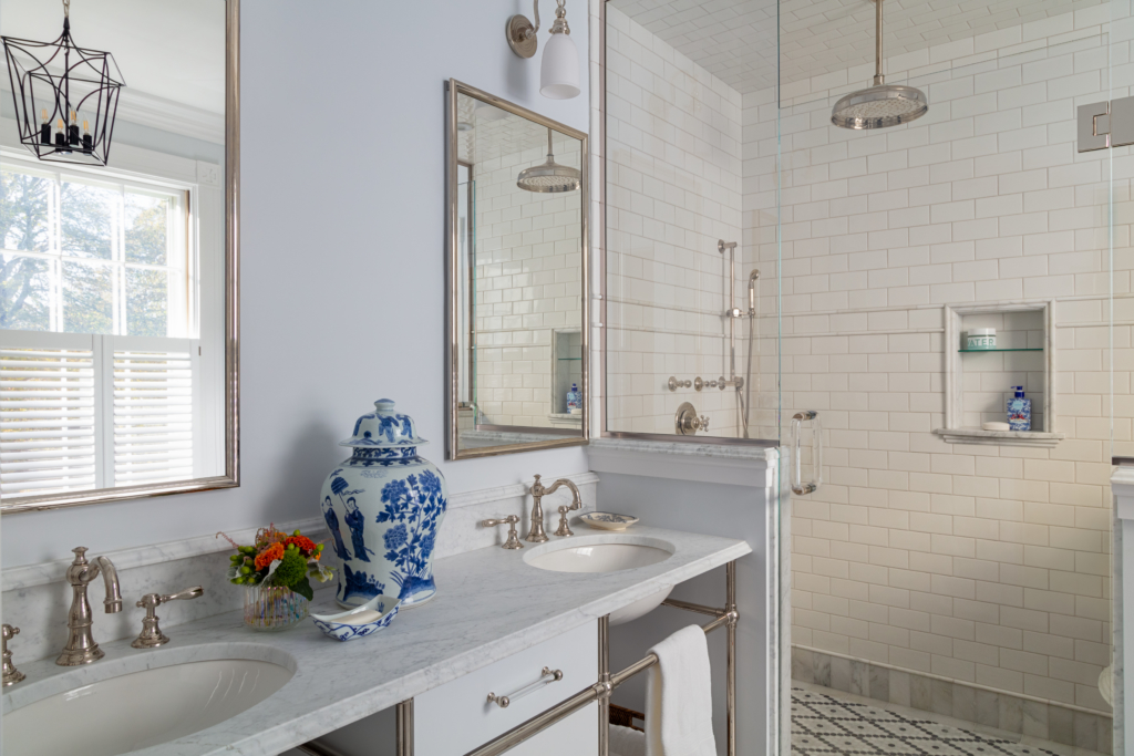 duel-sink vanity and shower in primary bathroom