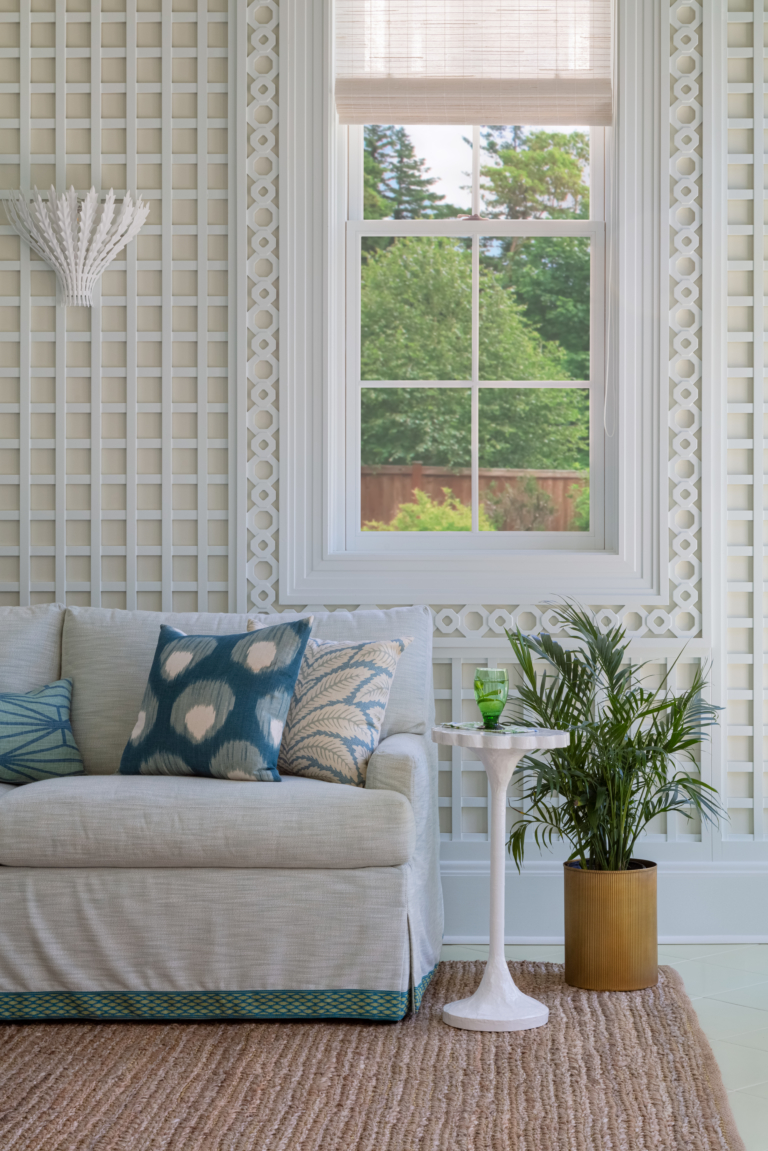 sofa in poolside cabana with latticed walls