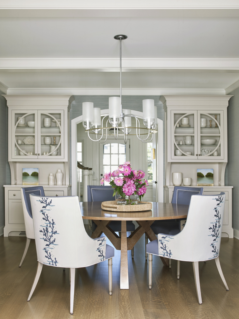 dining area with built in shelving and large table