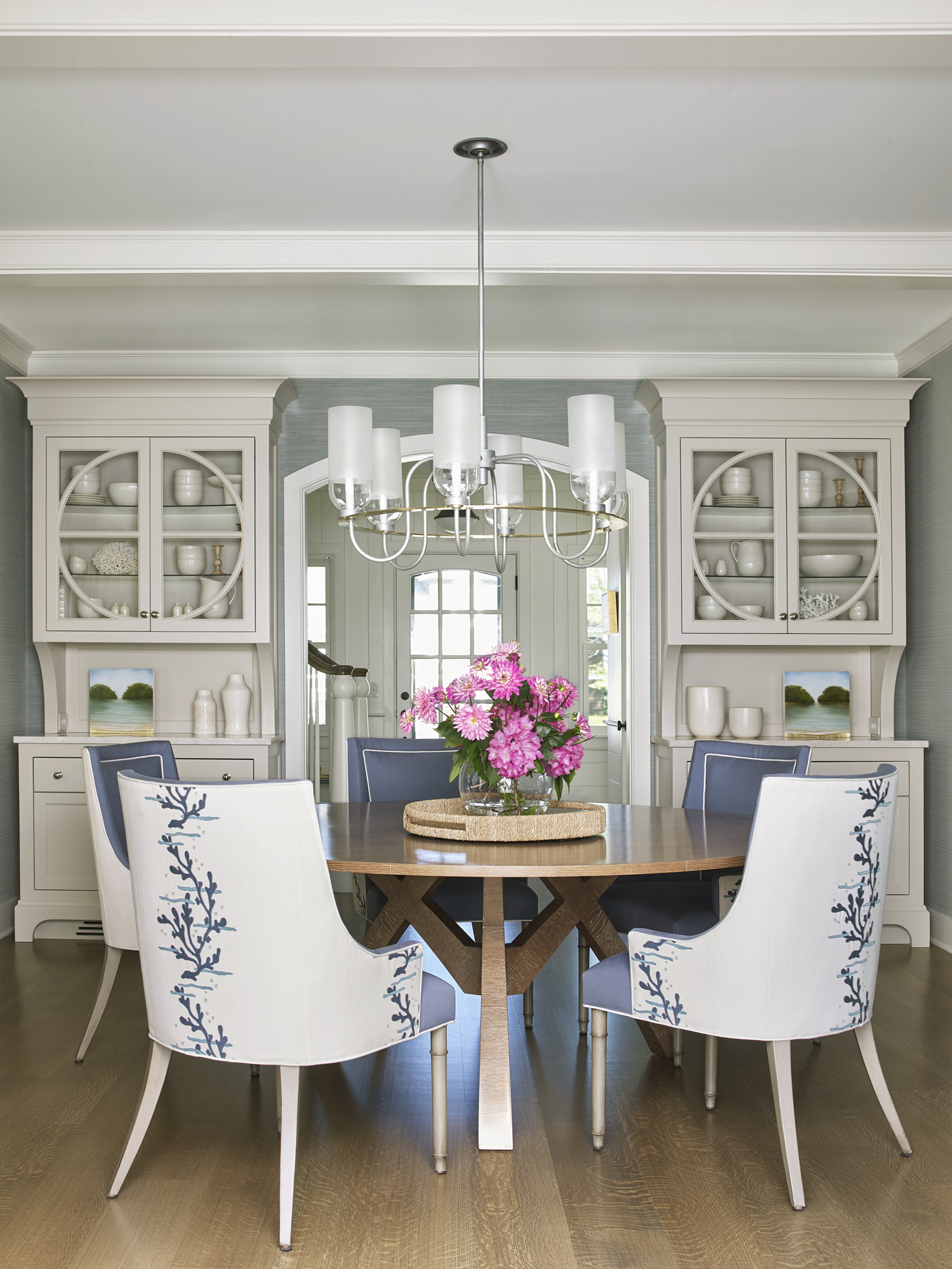 dining area with built in shelving and large table