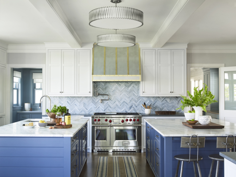 large, open kitchen with two islands and pops of color