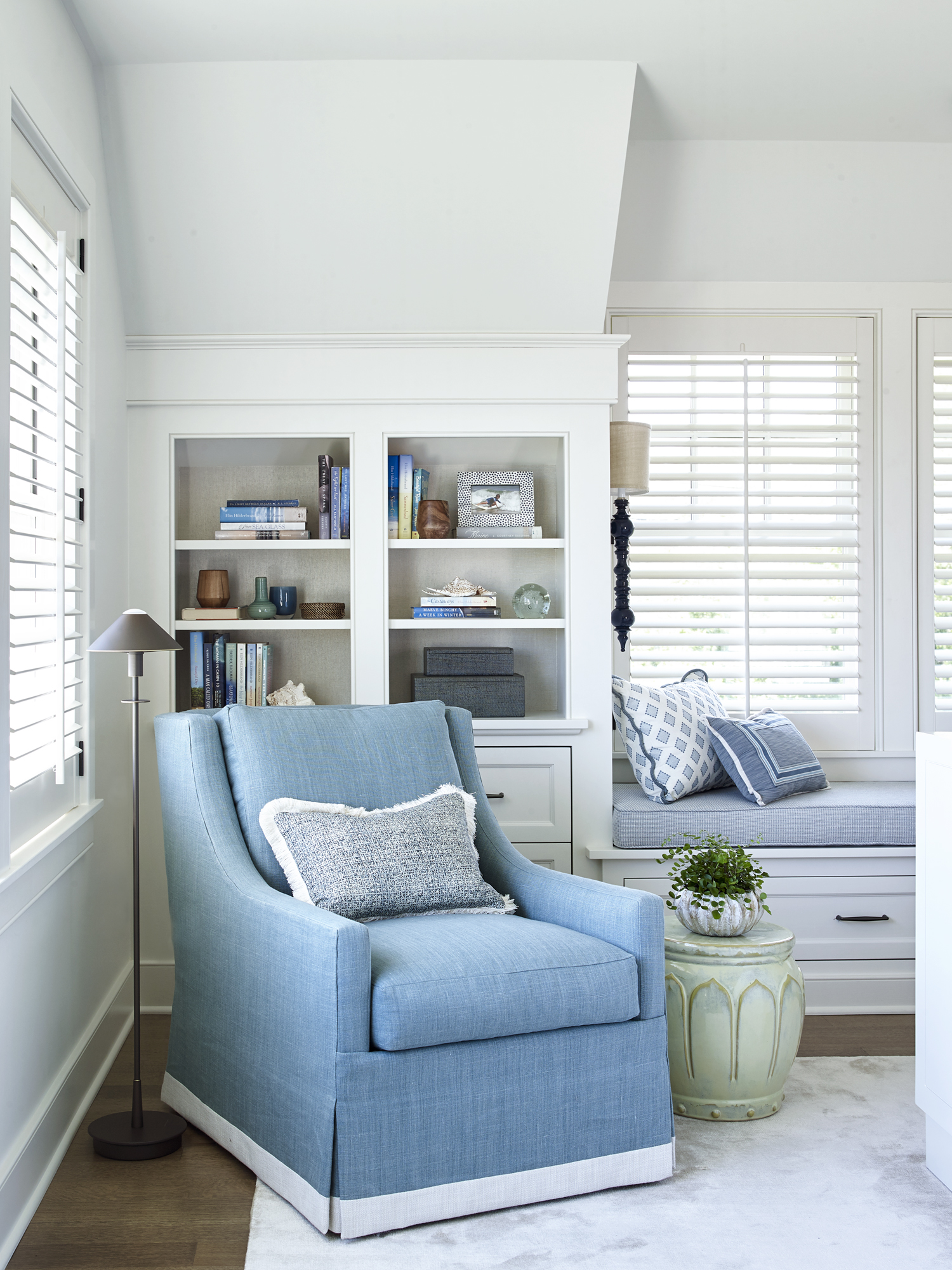 primary bedroom seating area with built-in shelving