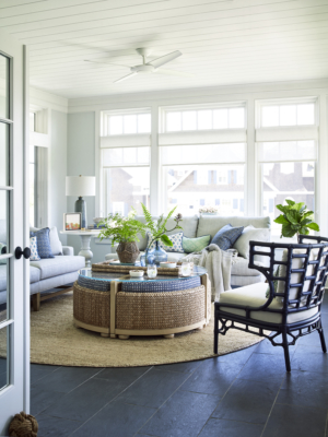 sun room with large seating area and ottoman