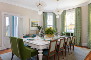 set dining table with drapery and chandelier lighting