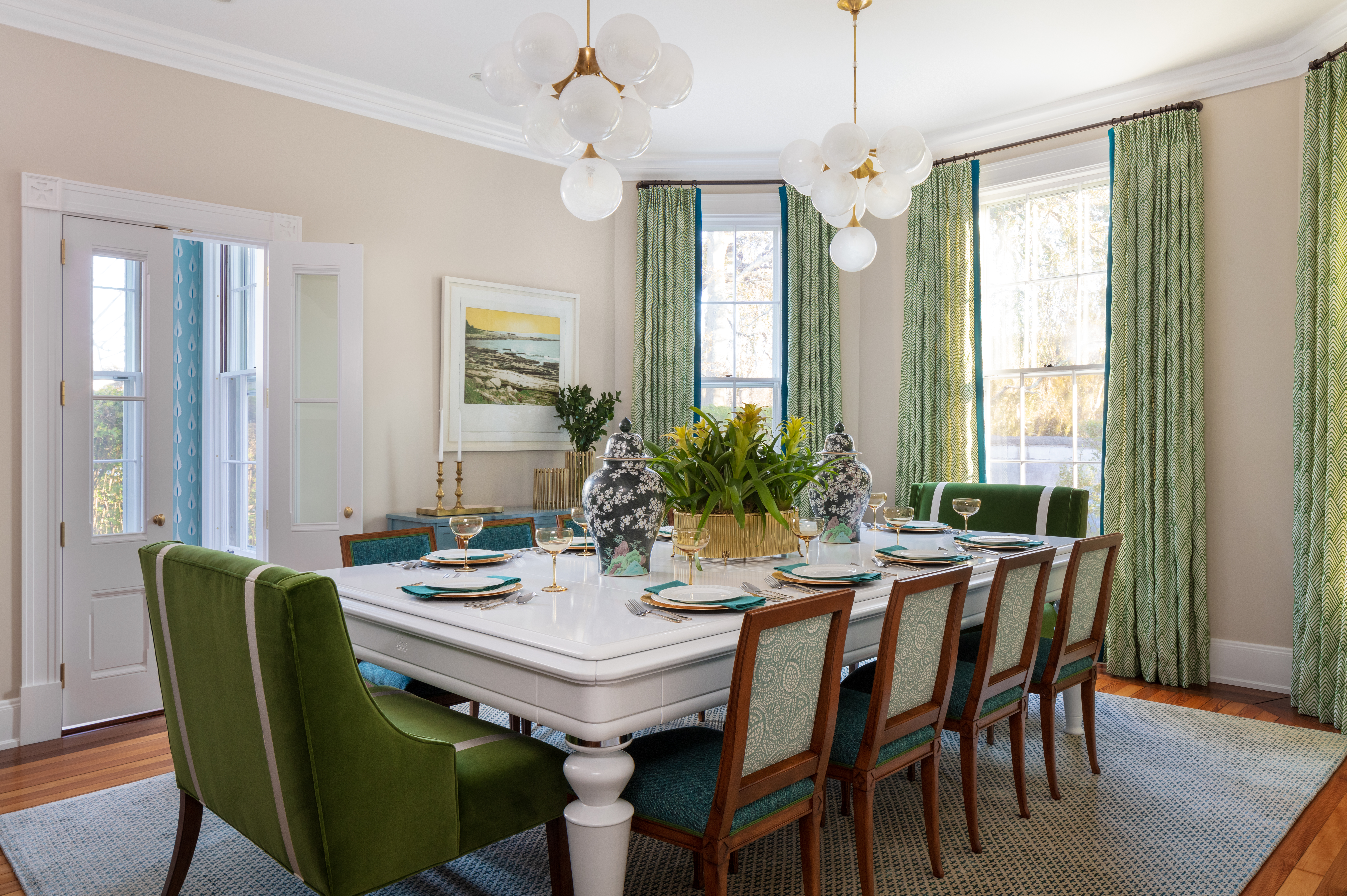 set dining table with drapery and chandelier lighting