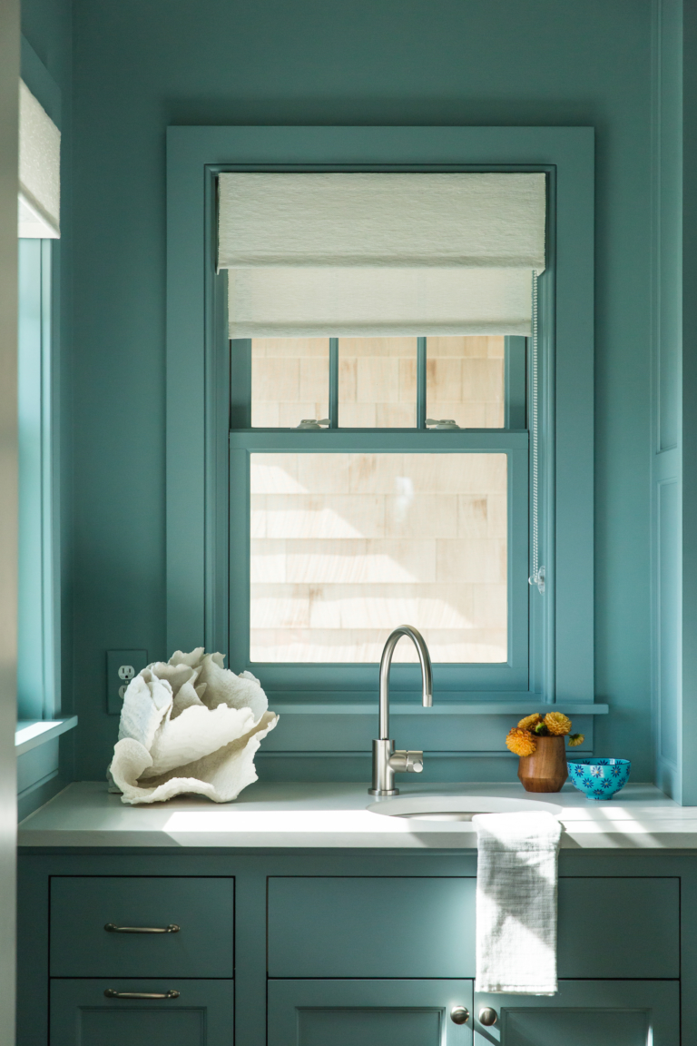 butlers pantry with blue wall and sink