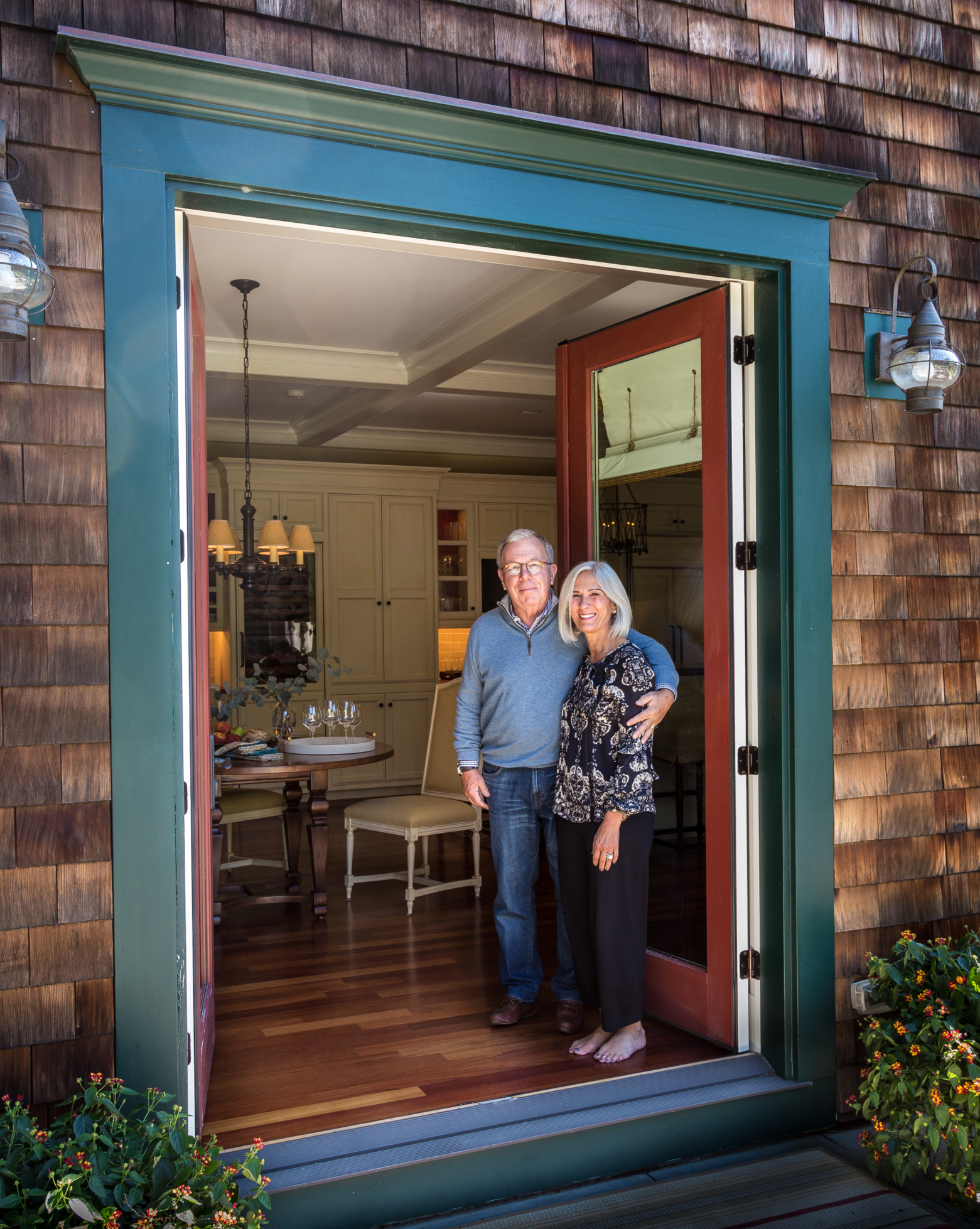 Taste Interior Design clients in their doorway