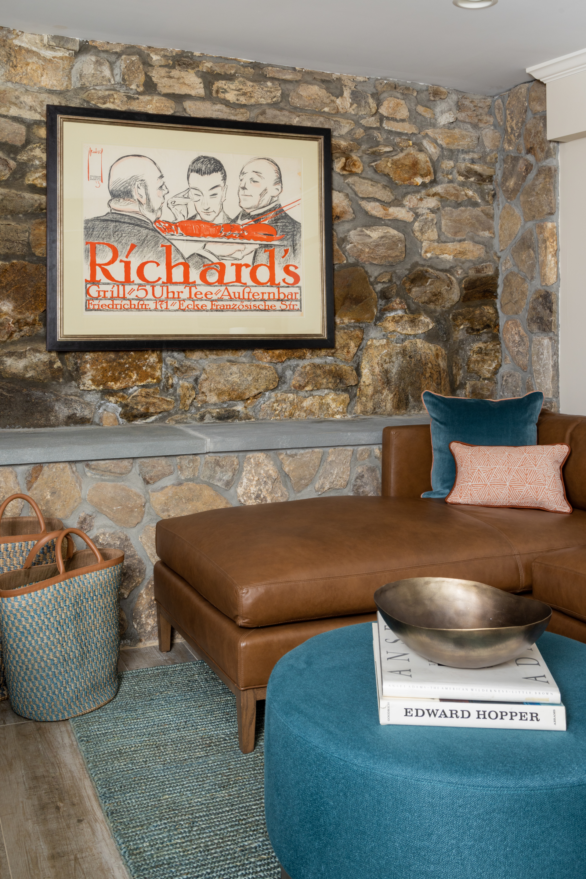 interior design project in Ridgefield CT, basement den with leather furniture and stone walls