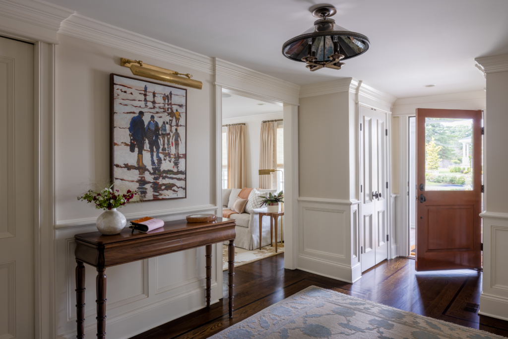 Foyer with front door and original art, interior design project in Ridgefield Connecticut
