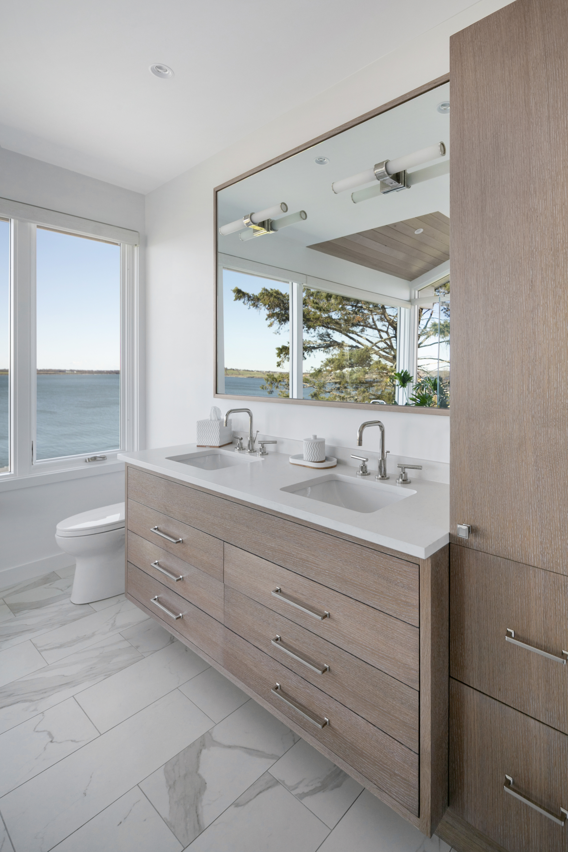 Primary Bathroom vanity and duel sink with ocean view