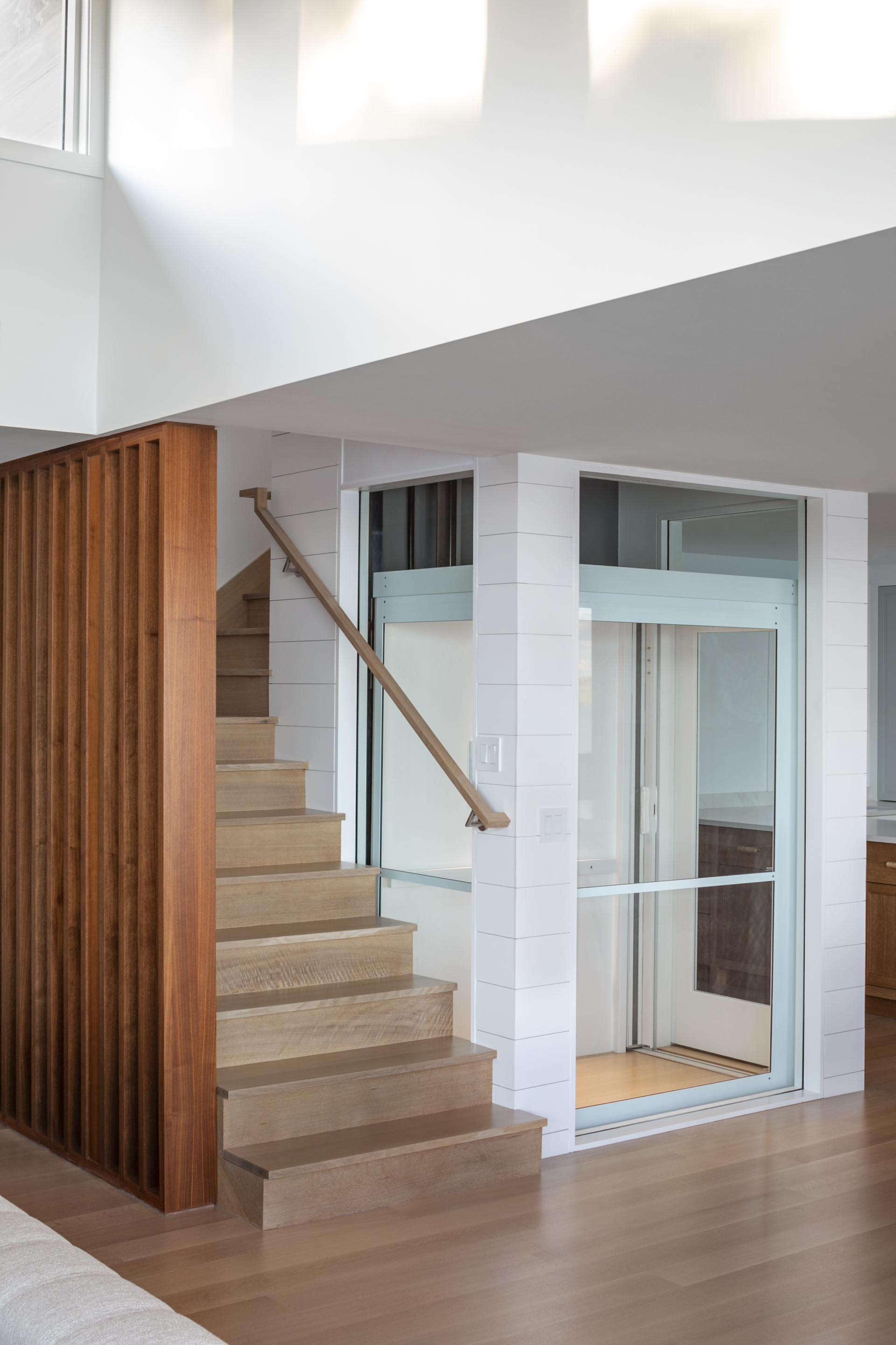 modern stairway design and exposed elevator shaft