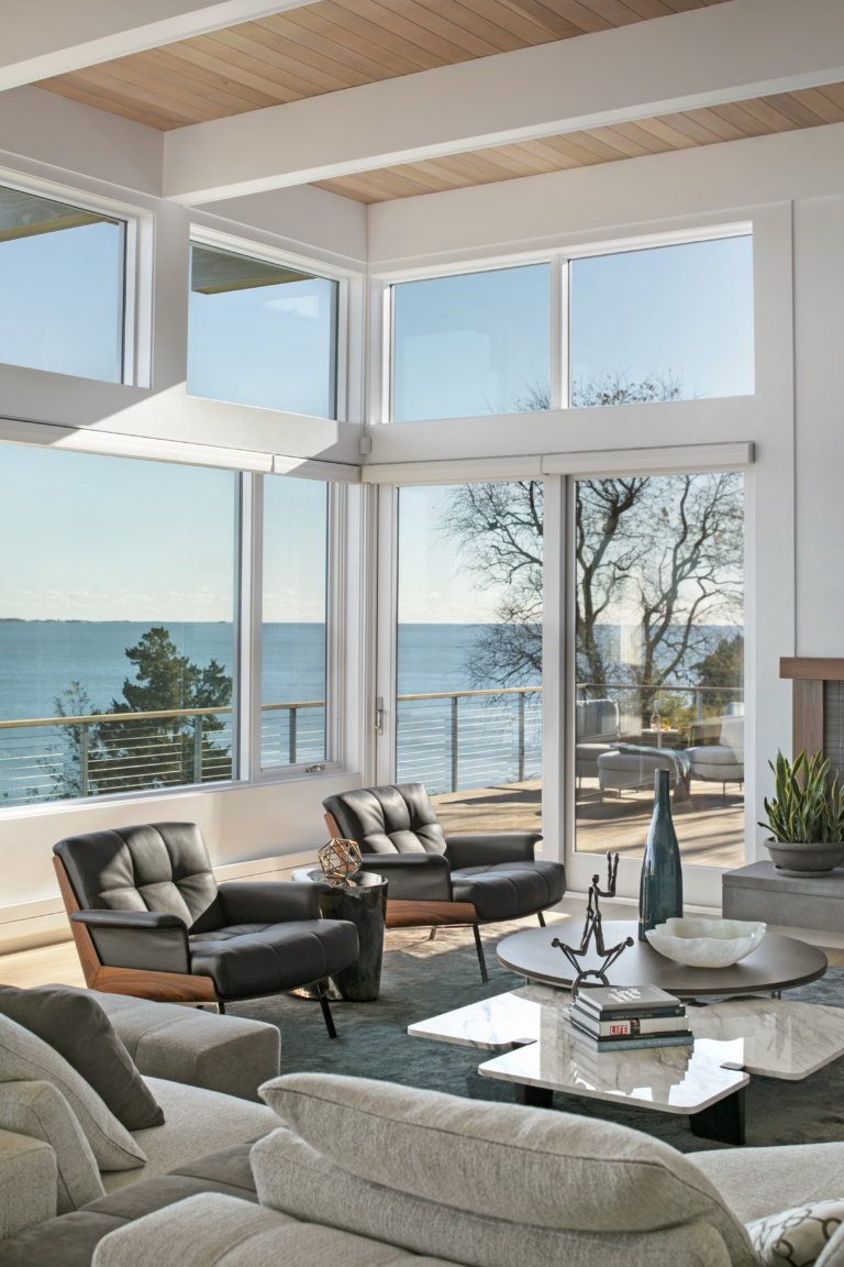 open-concept living room with modern furnishings and an ocean view