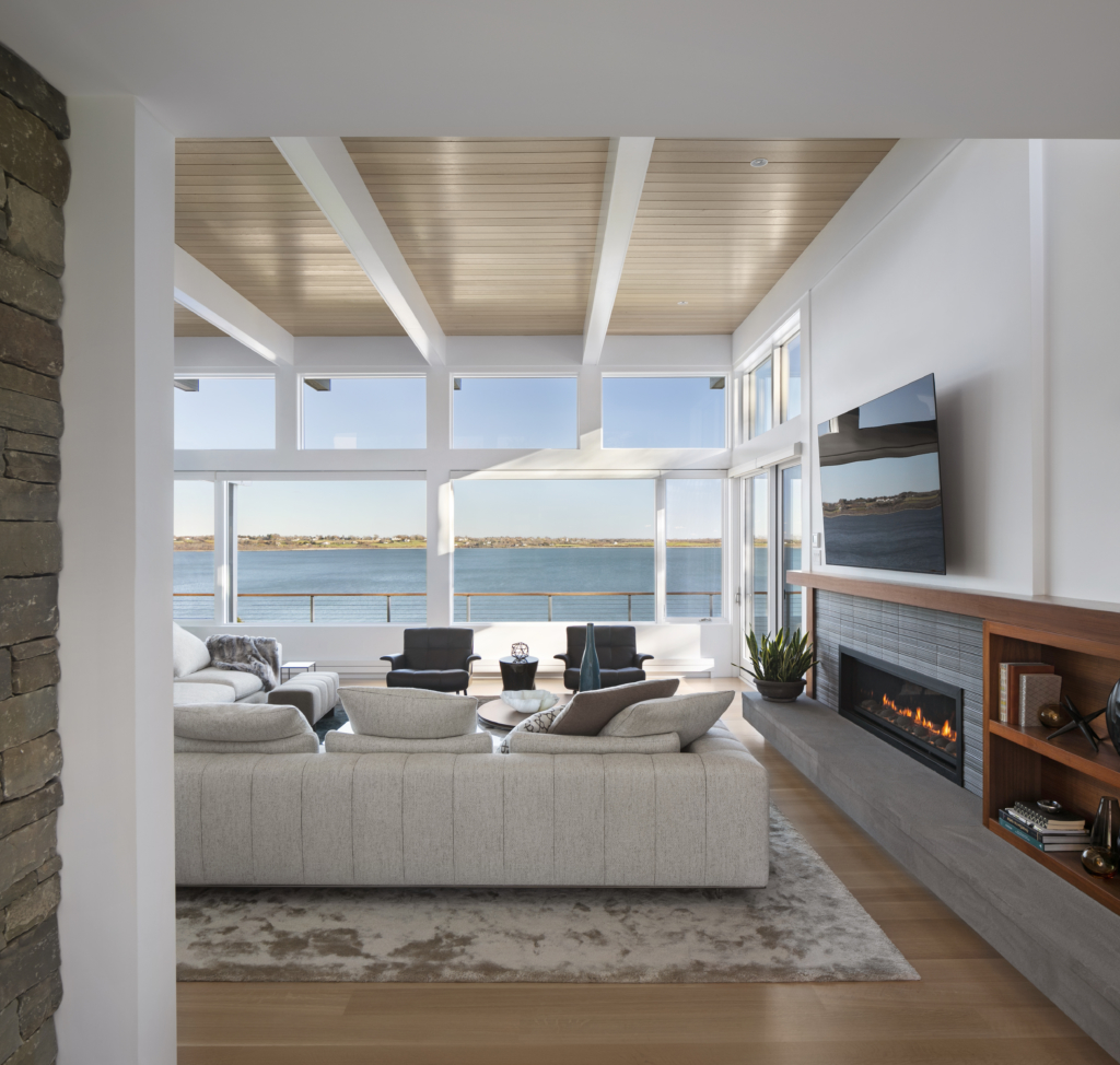 open-concept living room with modern furnishings and an ocean view