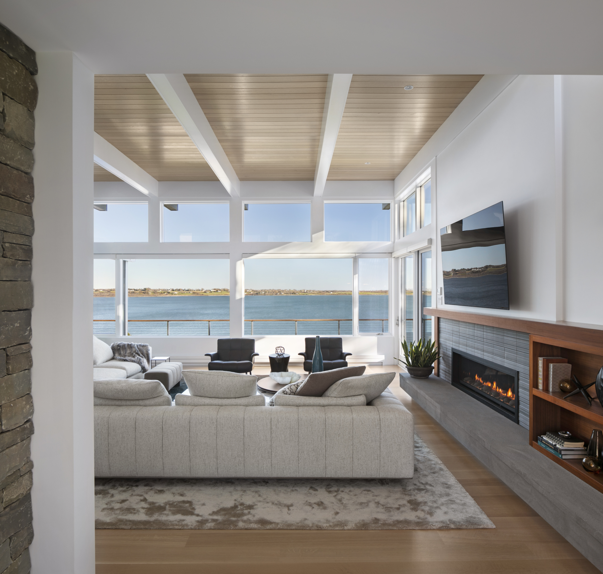 open-concept living room with modern furnishings and an ocean view