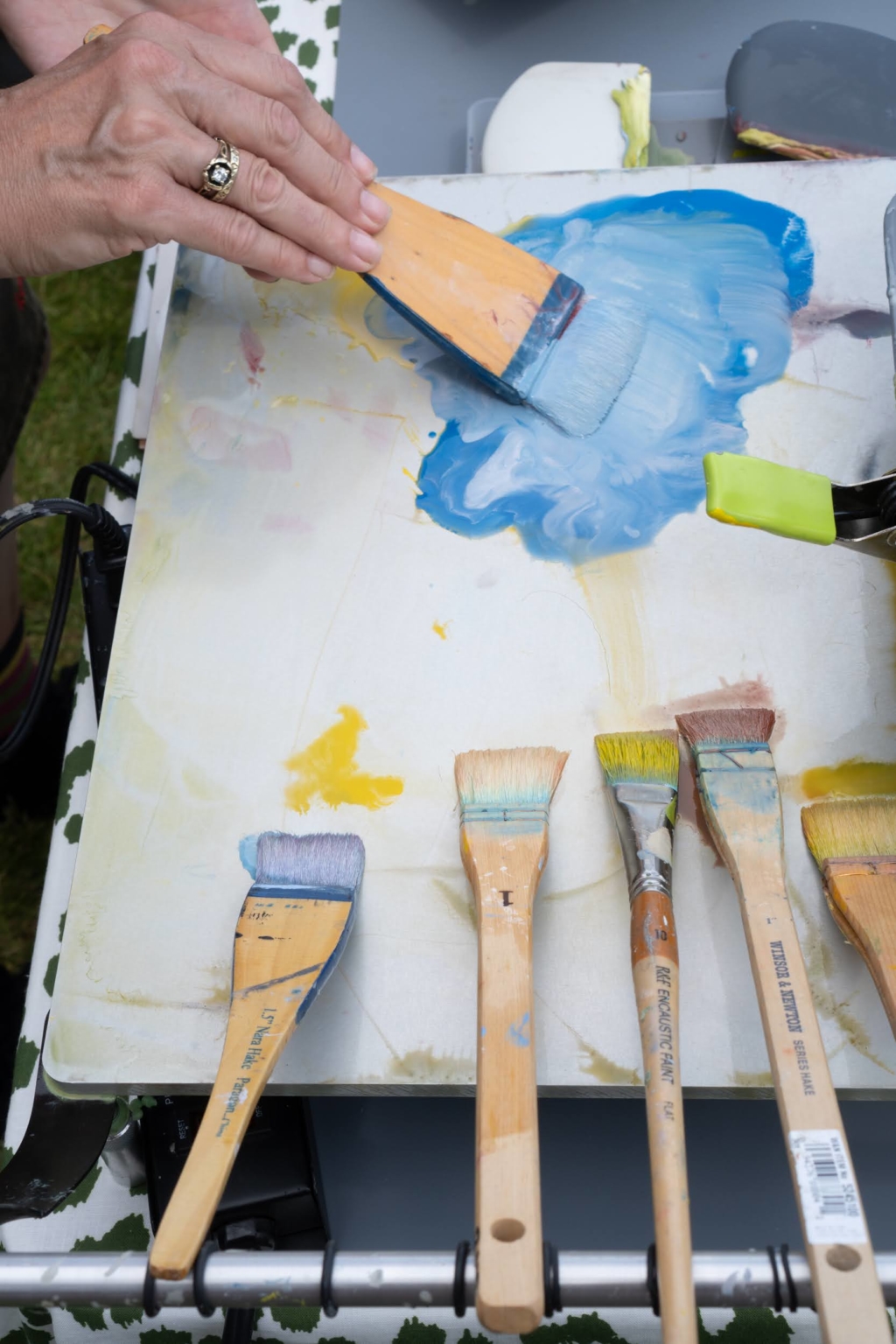 Encaustic paint with brushes on palate