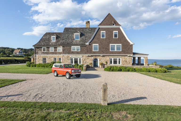 Stone Lea exterior of beach house with vintage red jeep