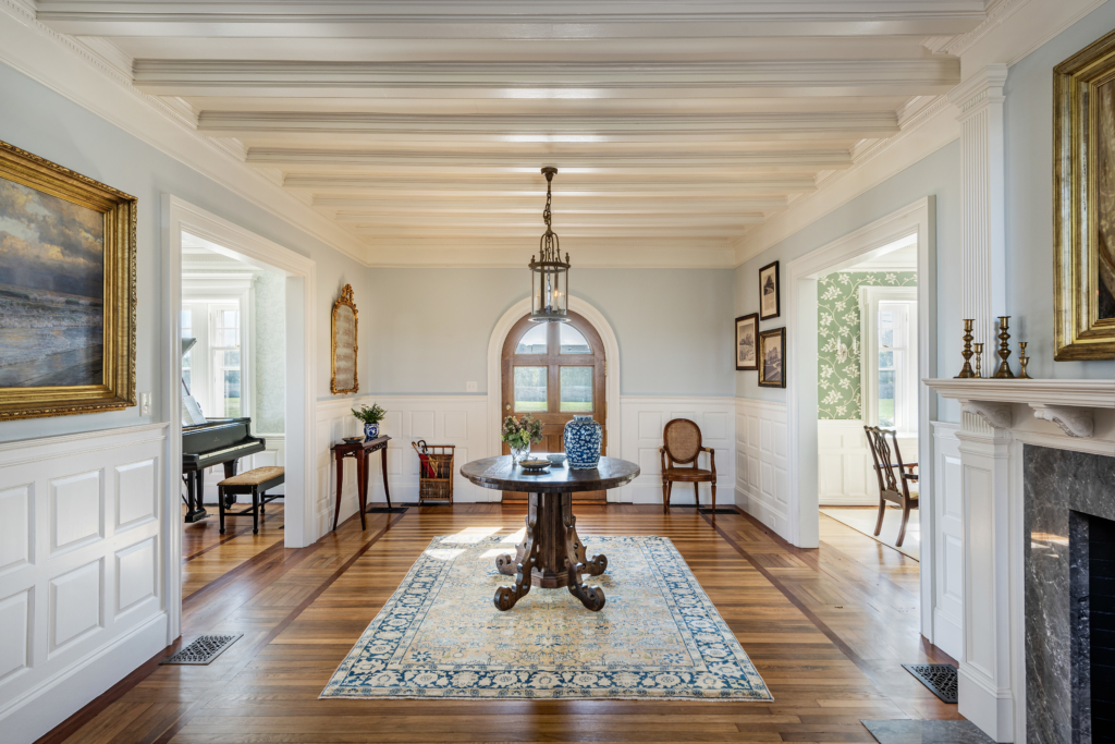 Front entrance with large foyer and antique furniture
