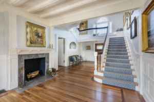 foyer with stairway and large fireplace