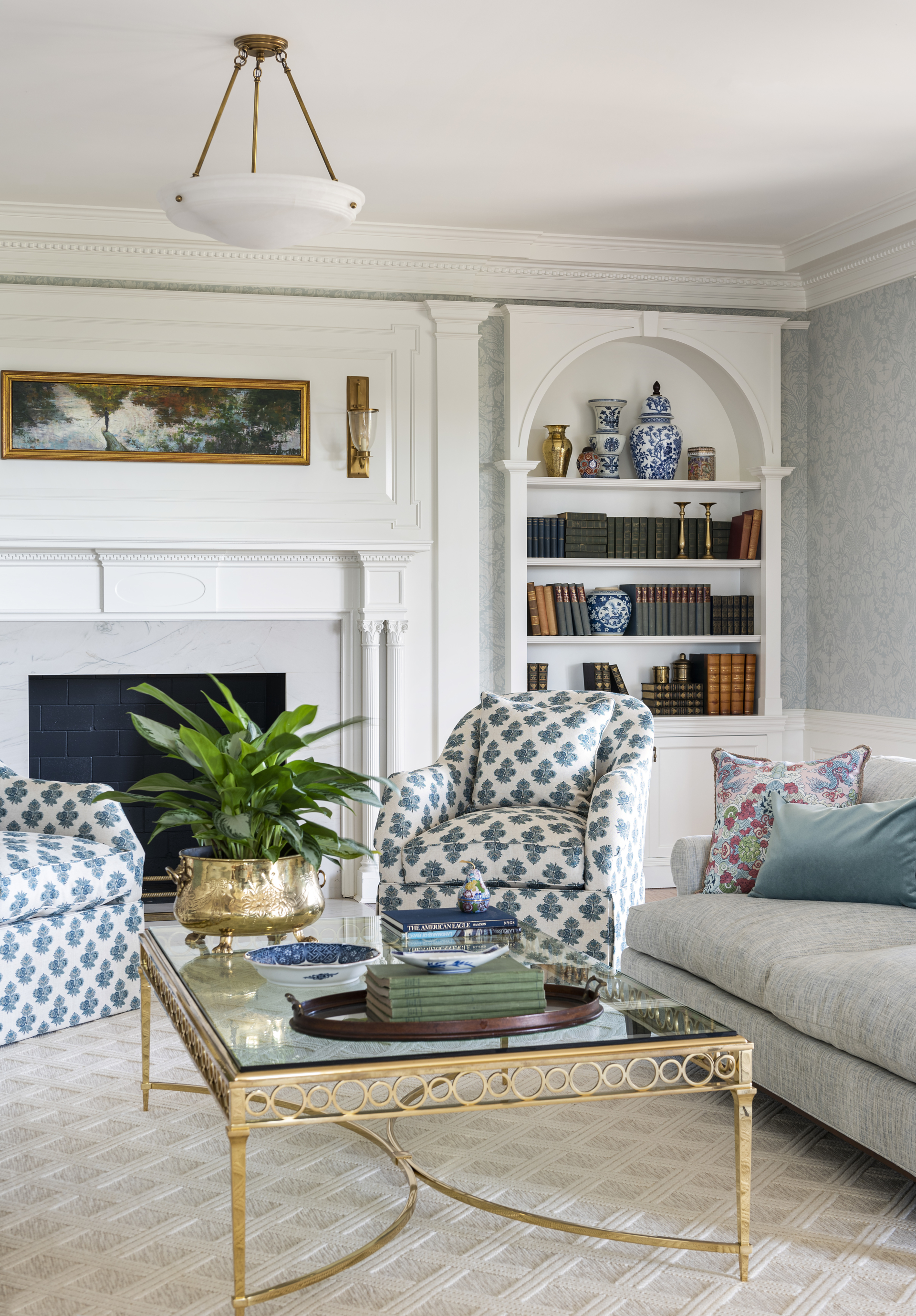 Living room with built ins around fireplace and bookcases