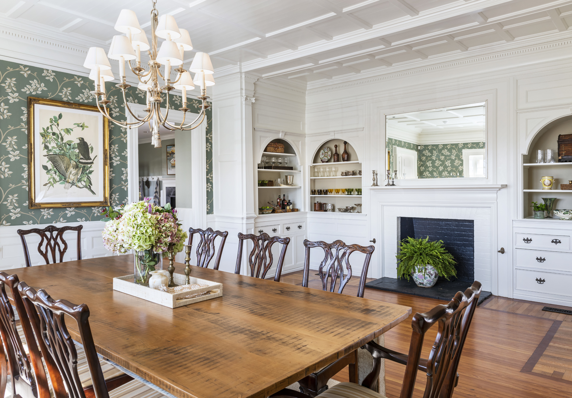 Dining room with wallpaper and fireplace