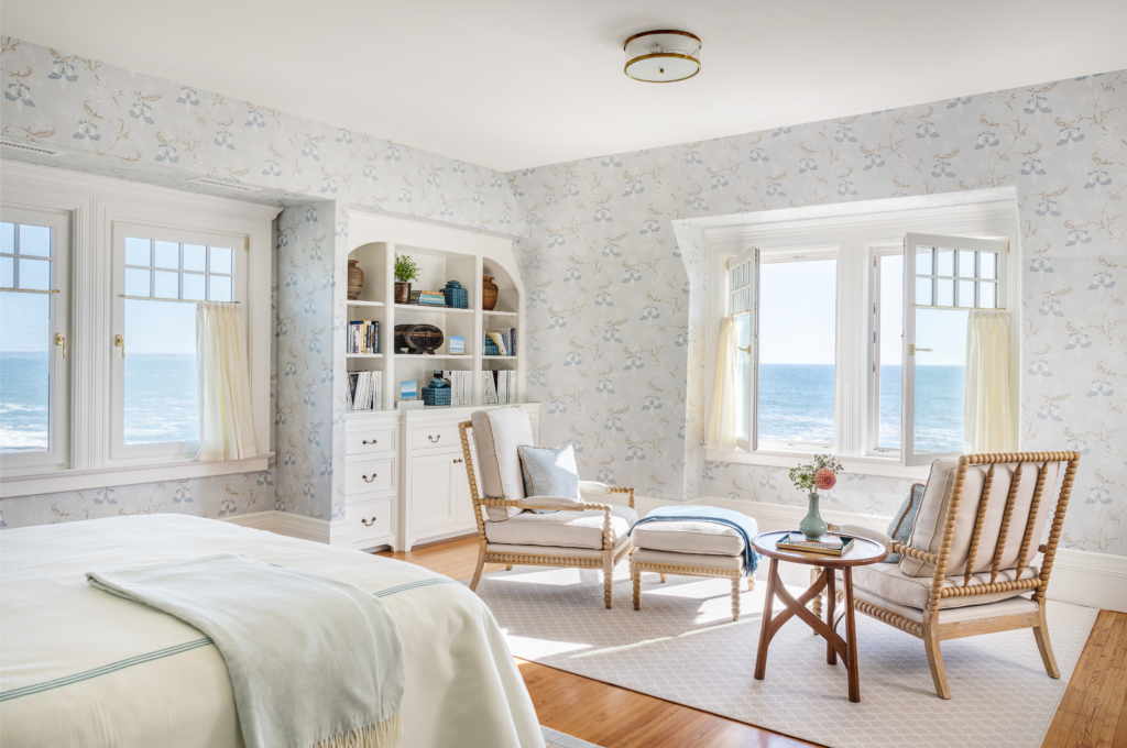 Primary bedroom with seating area and bookcase