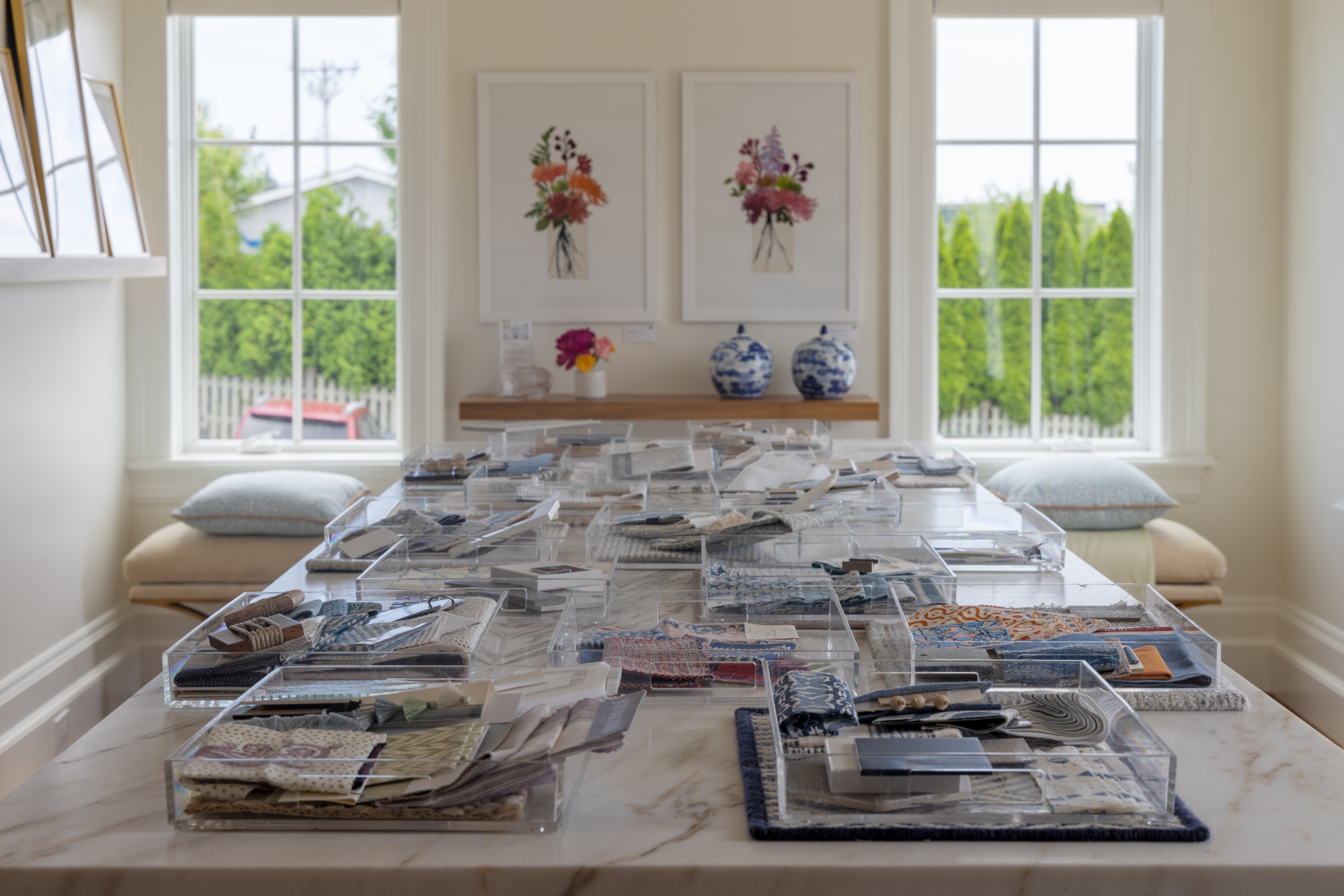 Materials trays on island in interior design firm's office