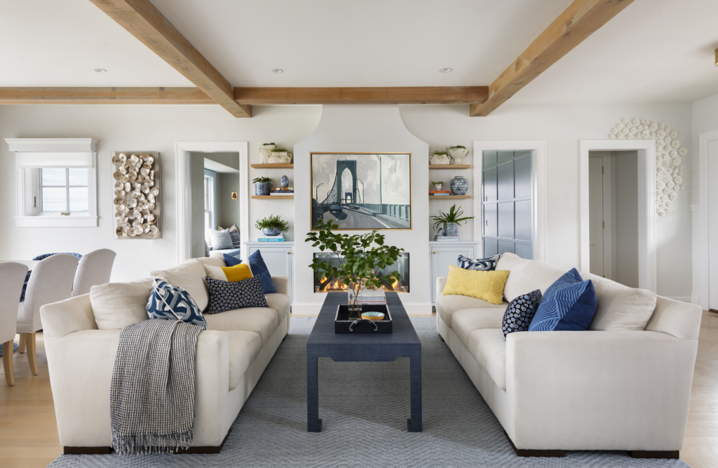 Open-concept great room in a family home. Exposed beams, original art, and luxury custom furniture.