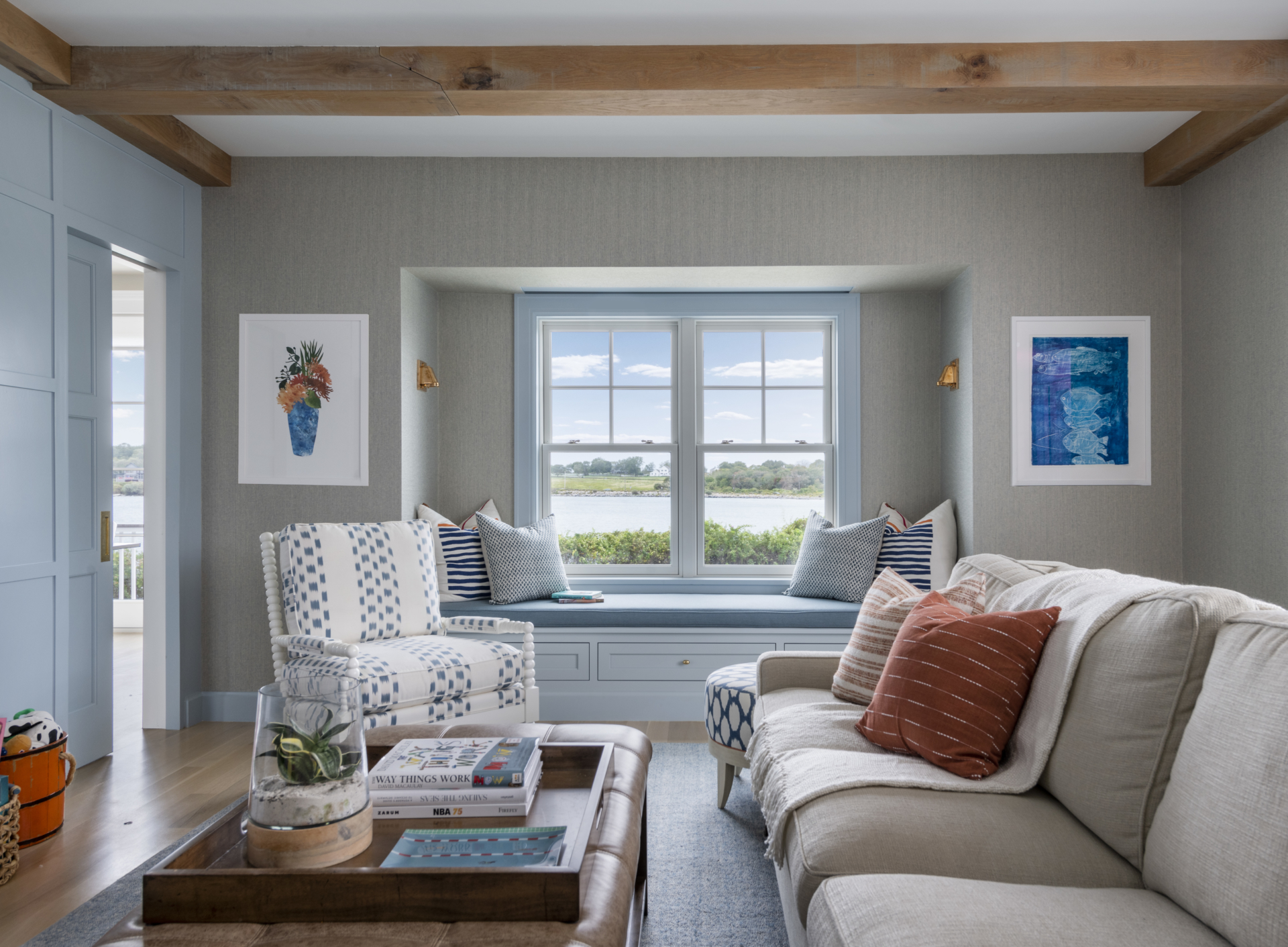 Family living room with window seat and ocean view. Luxury living space