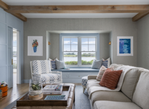Family living room with window seat and ocean view. Luxury living space