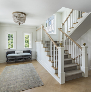 A modern coastal home entryway and staircase designed by Taste Design and Paul Weber near Newport RI