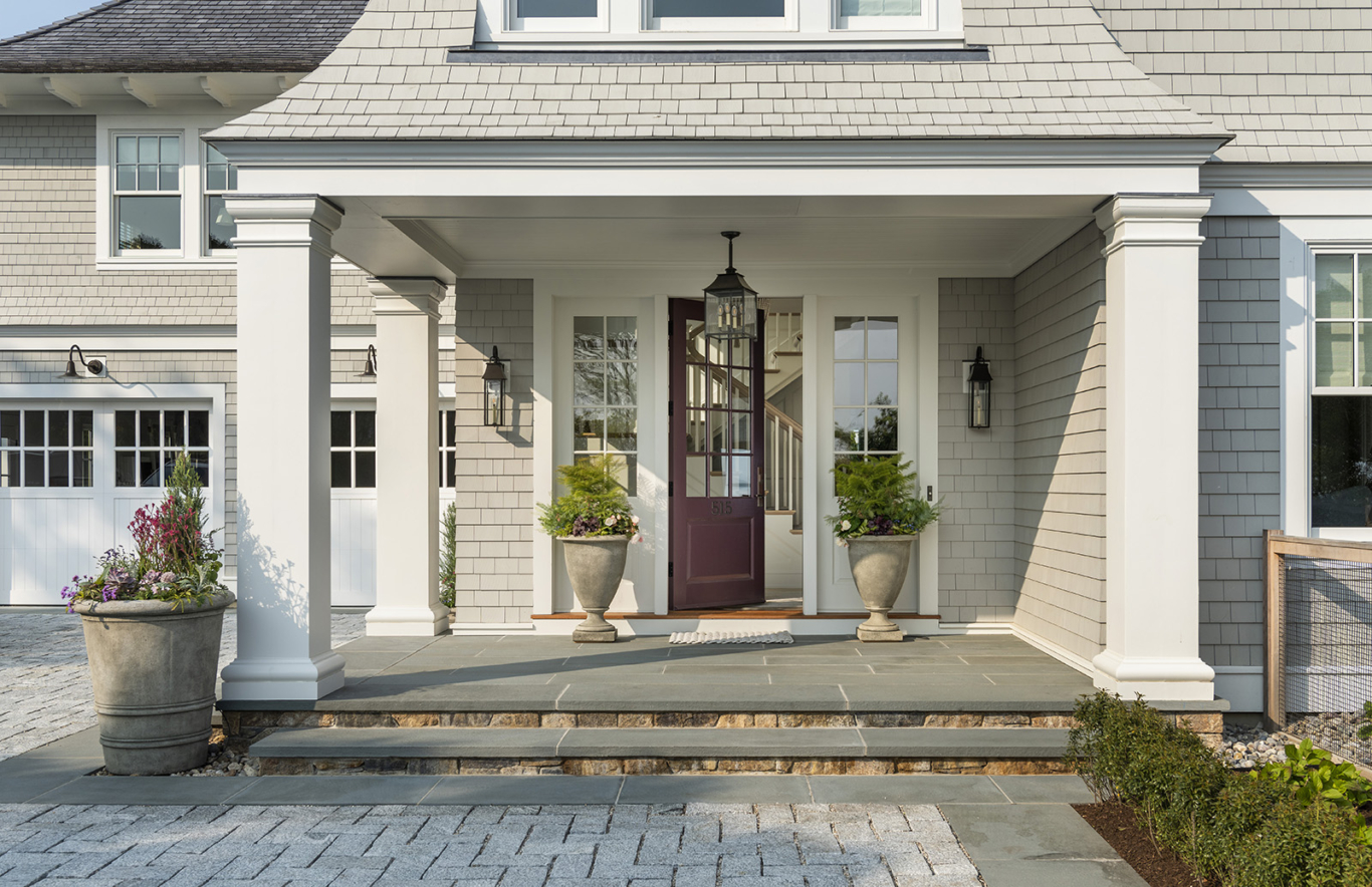 A modern coastal home purple front door designed by Taste Design and Paul Weber home near Newport RI