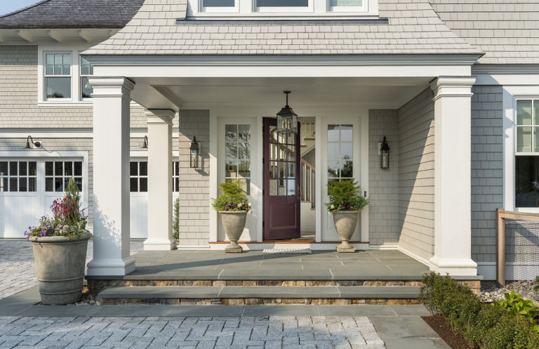A modern coastal home purple front door designed by Taste Design and Paul Weber home near Newport RI