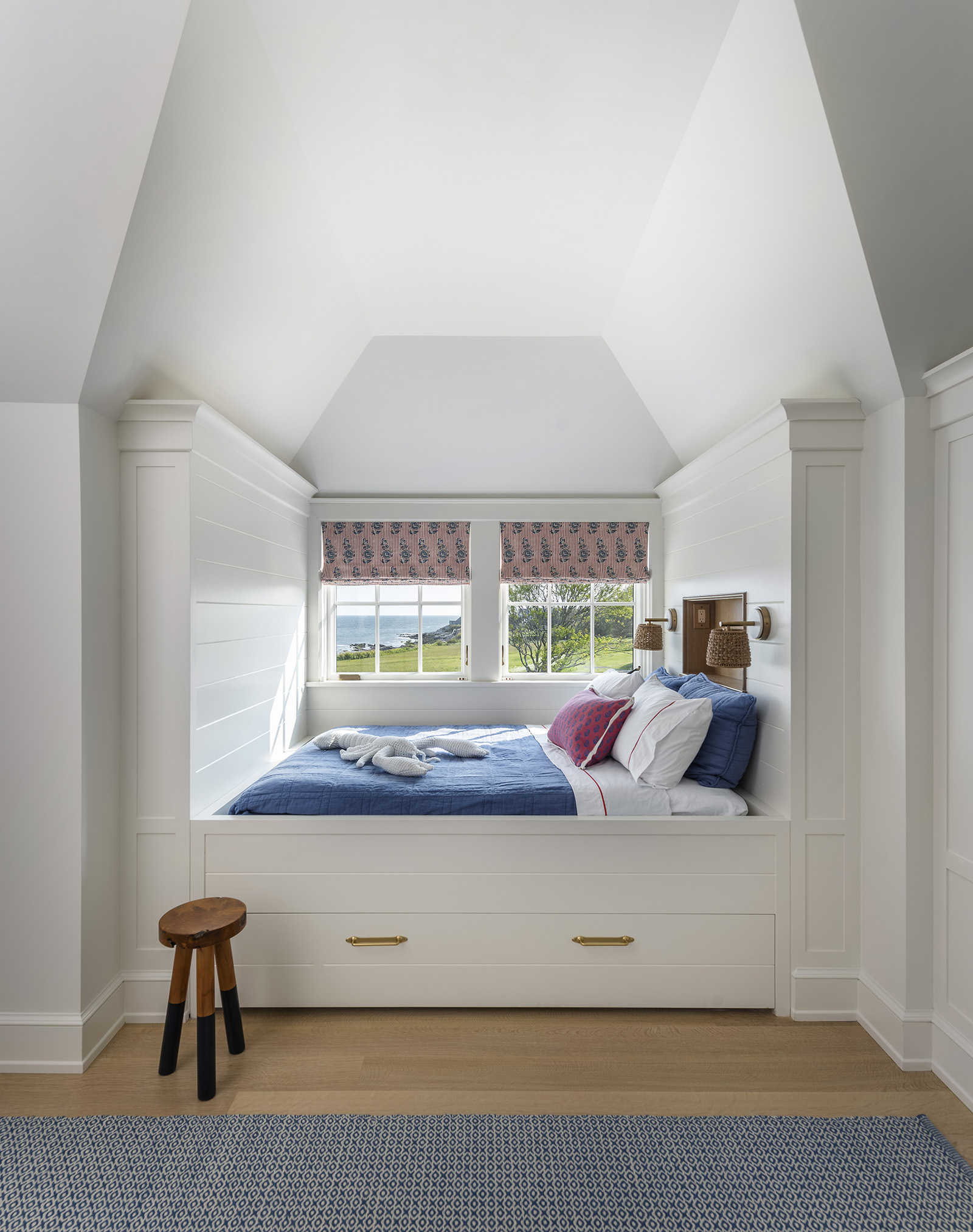A custom built in bed with a trundle bed below.
