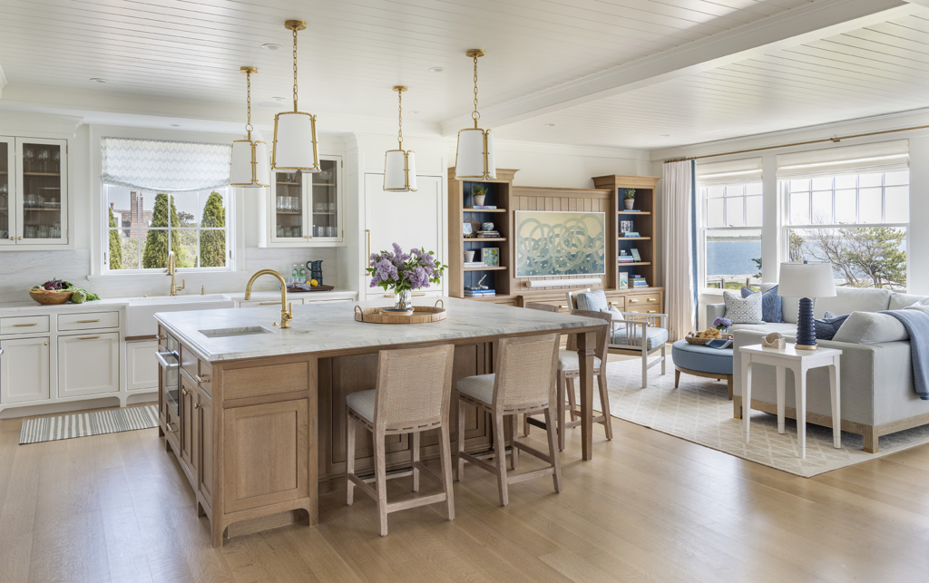 A bright open concept kitchen designed by Taste Design in a modern coastal home near Newport RI