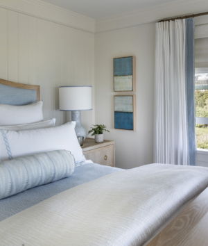 Owner's blue and white bedroom in a modern coastal home designed by Taste Design Inc and Paul Weber Architecture near Newport RI
