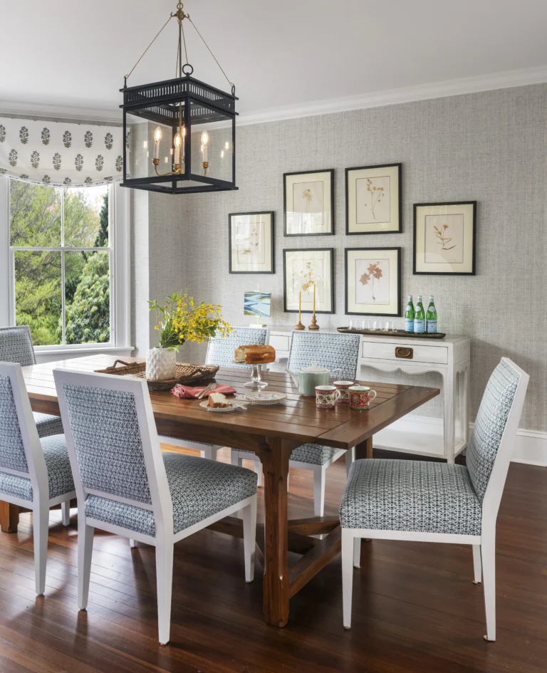 Dining room with custom table and grasscloth wallpaper