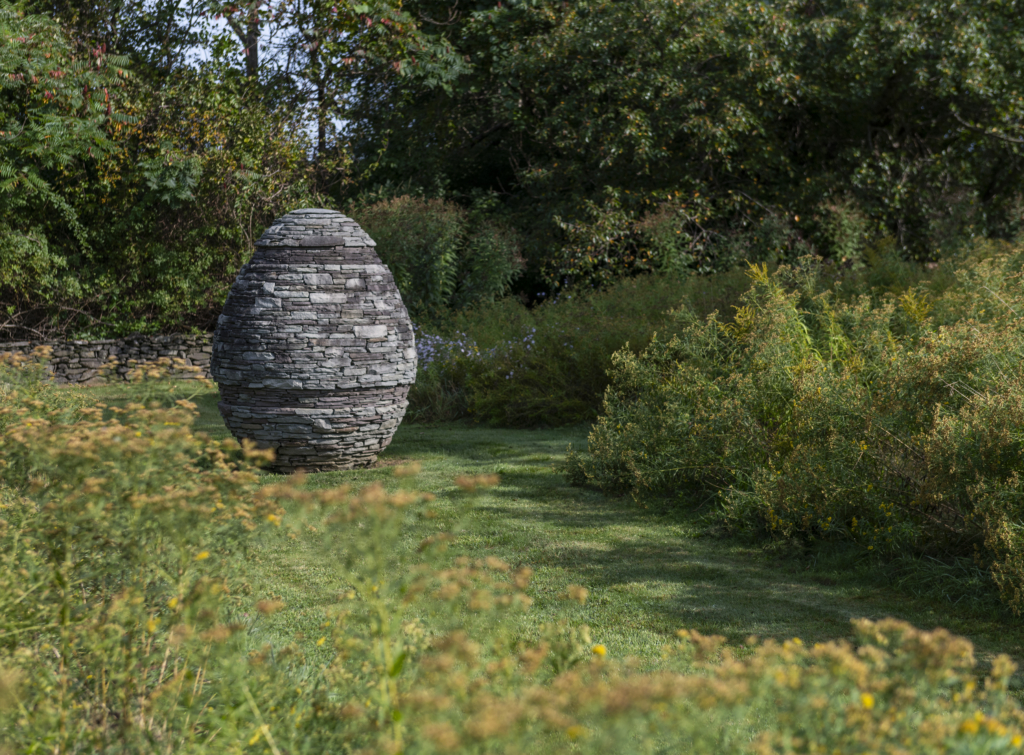 A garden with a large cairn