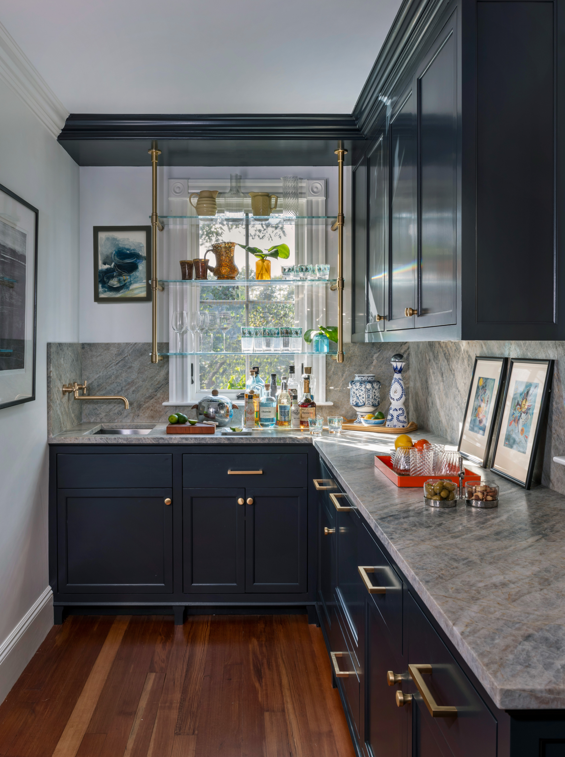 A butler's pantry with dark blue cabinetry