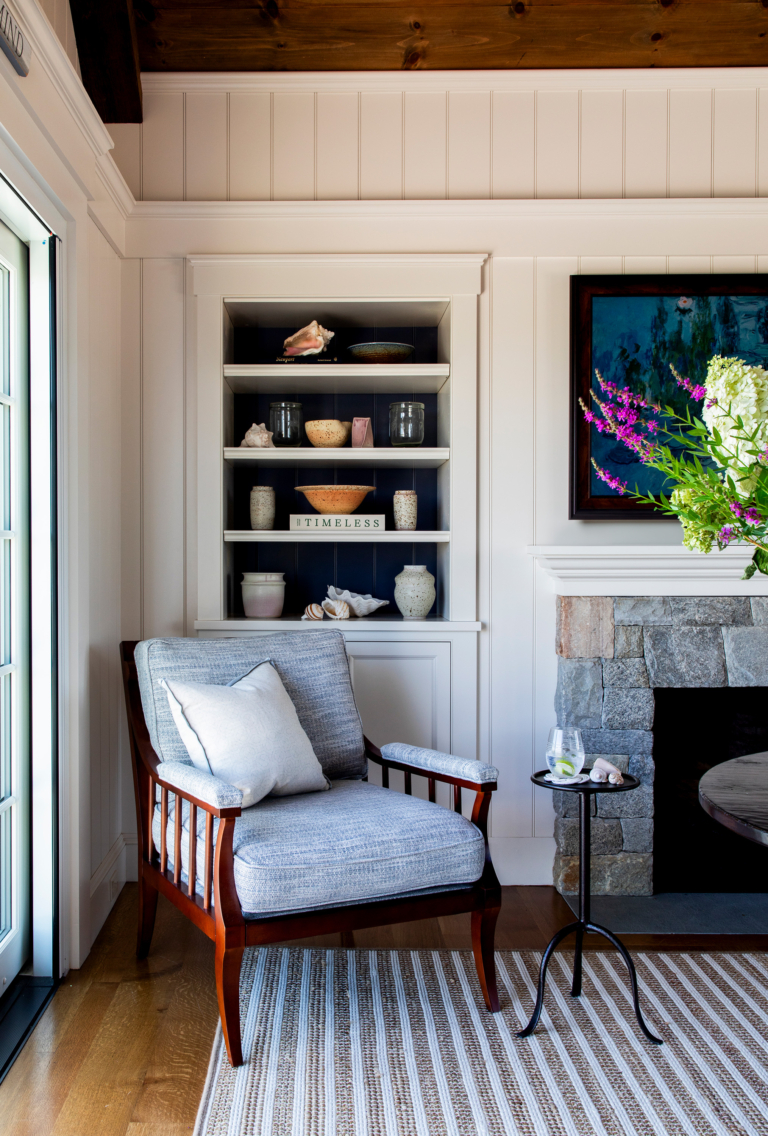 Cozy reading corner at Ocean Lodge with built-in shelving, natural textures, and handcrafted ceramics styled by Taste Design Inc.