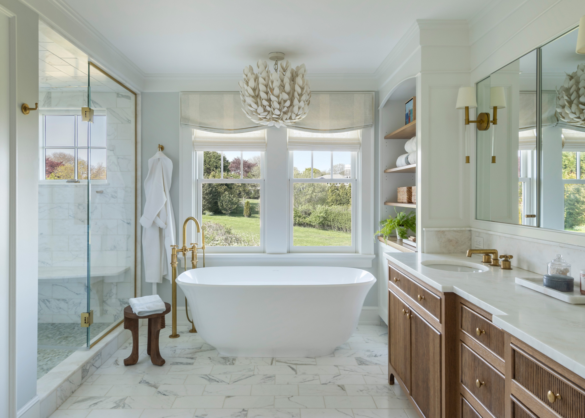 Bathroom with freestanding tub and caning on vanity