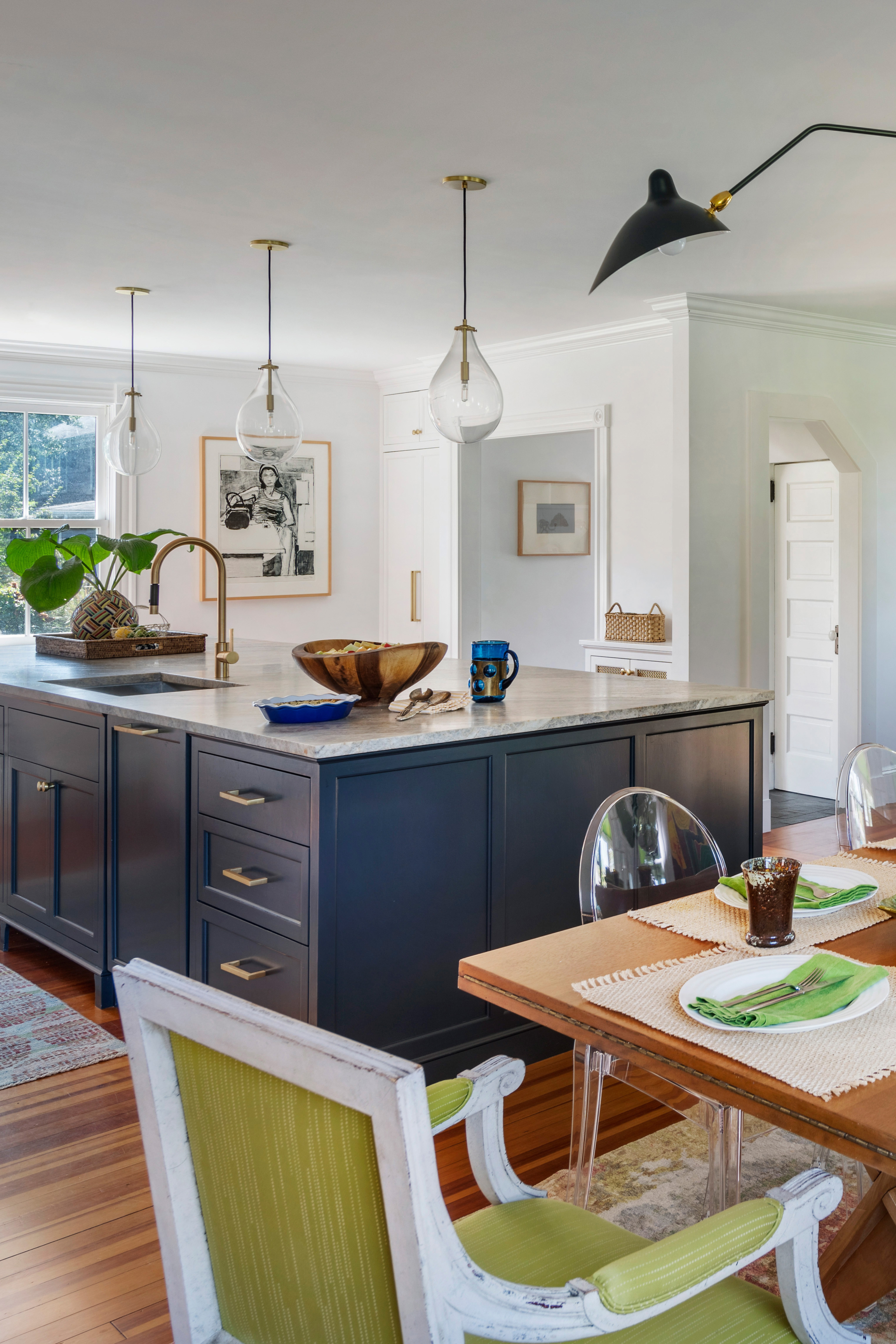 A dining room and kitchen open concept