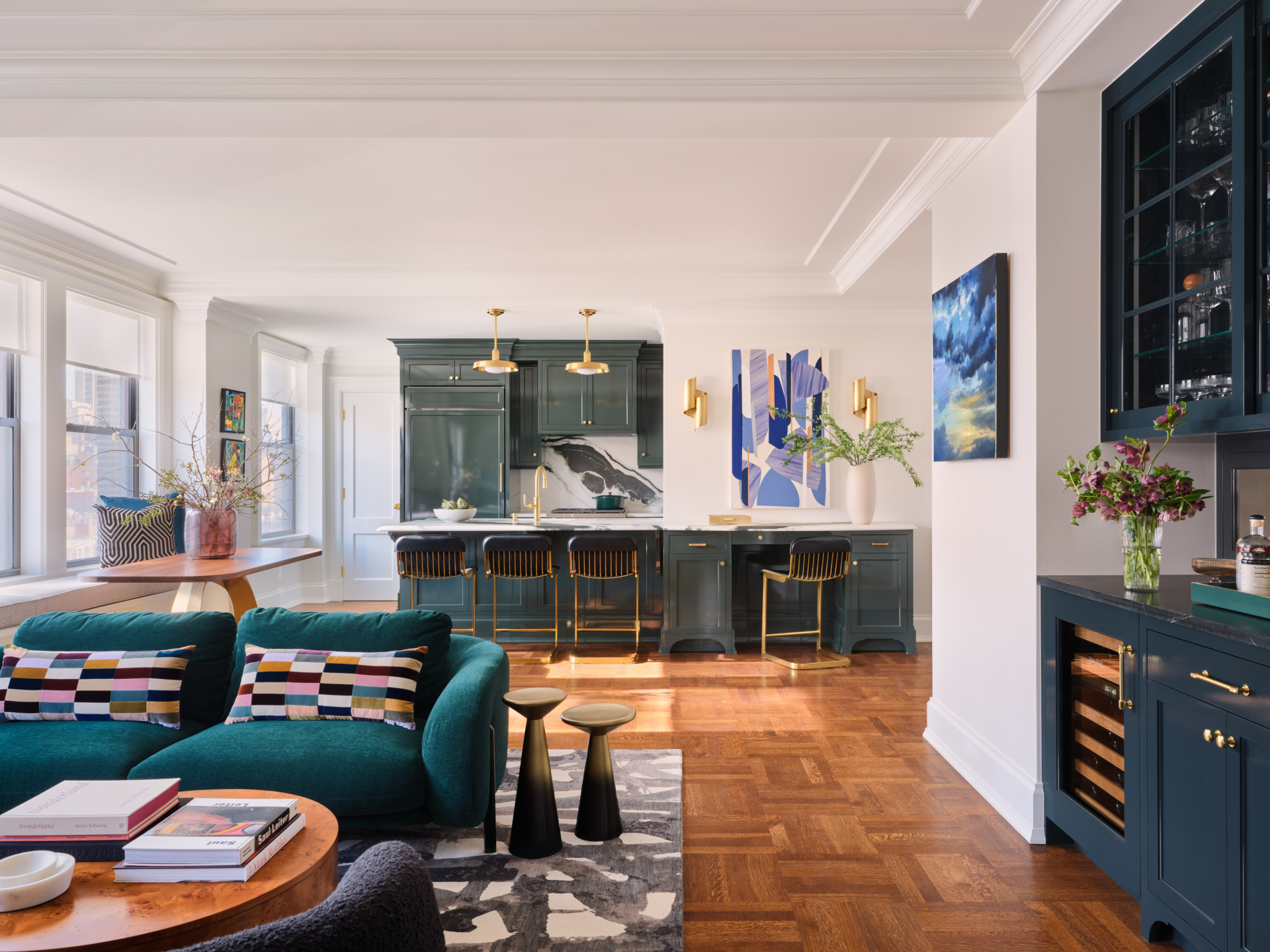 Open concept living room and kitchen in an UWS apartment designed by New York Interior designer Taste Design Inc.
