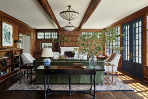 A wood-paneled living room with wooden ceiling beams